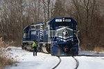 The conductor watches closely as 6355 cuts through the ice packed flangeways